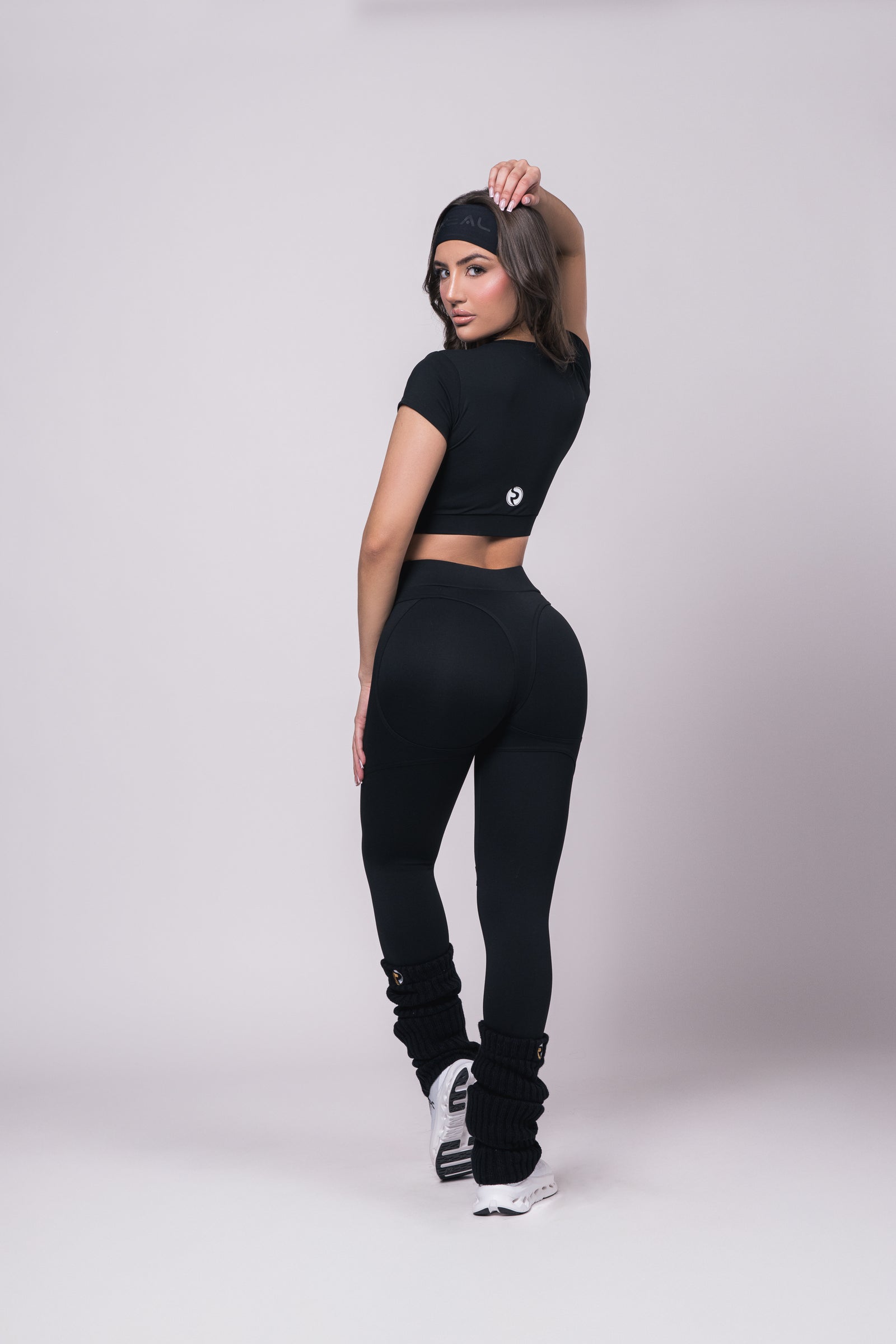 Woman wearing black Real Activewear Curve Legging - High-rise sculpting leggings by Real Wear US